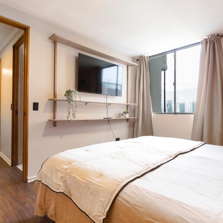Cómodo depto familiar con aire acondicionado, frente al Parque Arauco - Apartamento - 39