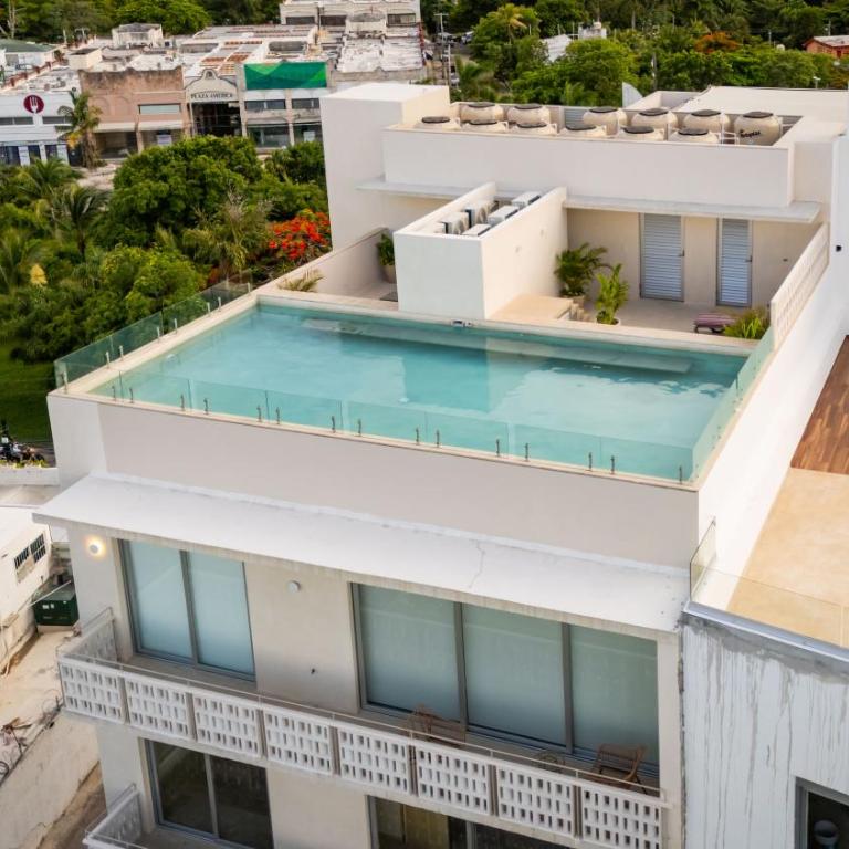 Ideal con rooftop con alberca en la entrada de Zona Hotelera - Apartamento de 2 dormitorios - 11