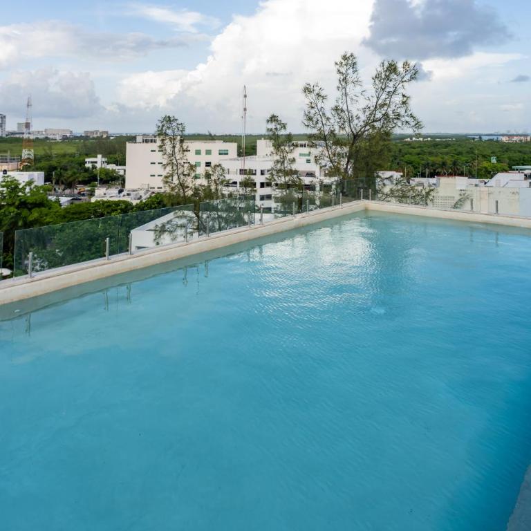 Ideal con rooftop con alberca en la entrada de Zona Hotelera - Apartamento de 2 dormitorios - 21