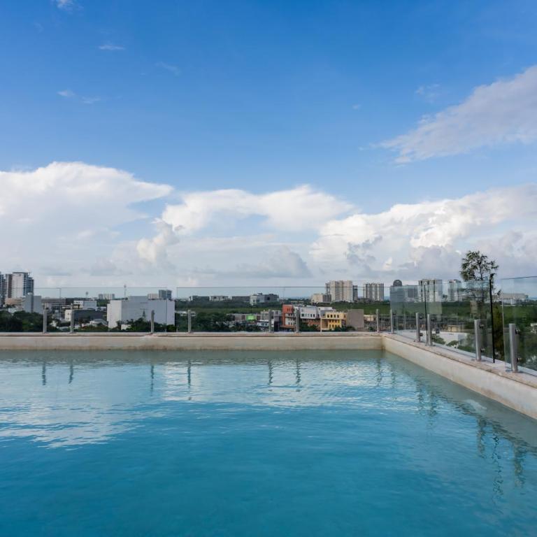 Ideal con rooftop con alberca en la entrada de Zona Hotelera - Apartamento de 2 dormitorios - 27