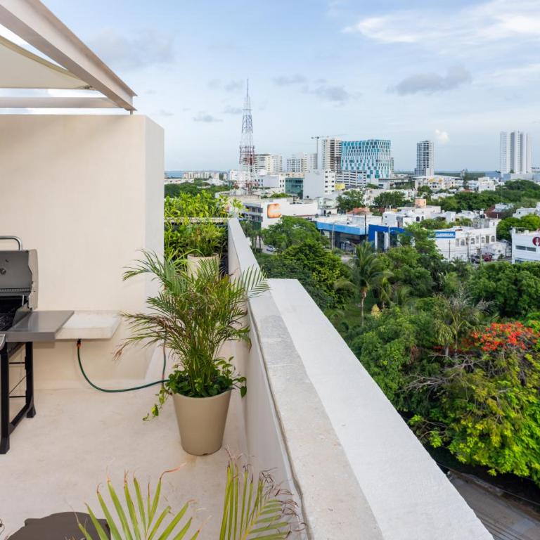 Ideal con rooftop con alberca en la entrada de Zona Hotelera - Apartamento de 2 dormitorios - 38