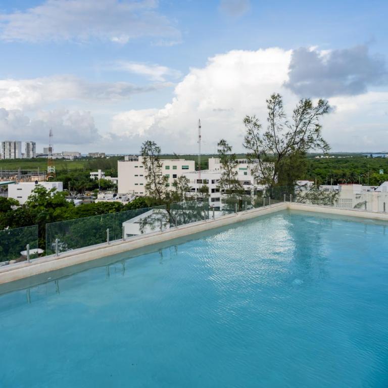 Ideal con rooftop con alberca en la entrada de Zona Hotelera - Apartamento de 2 dormitorios - 41