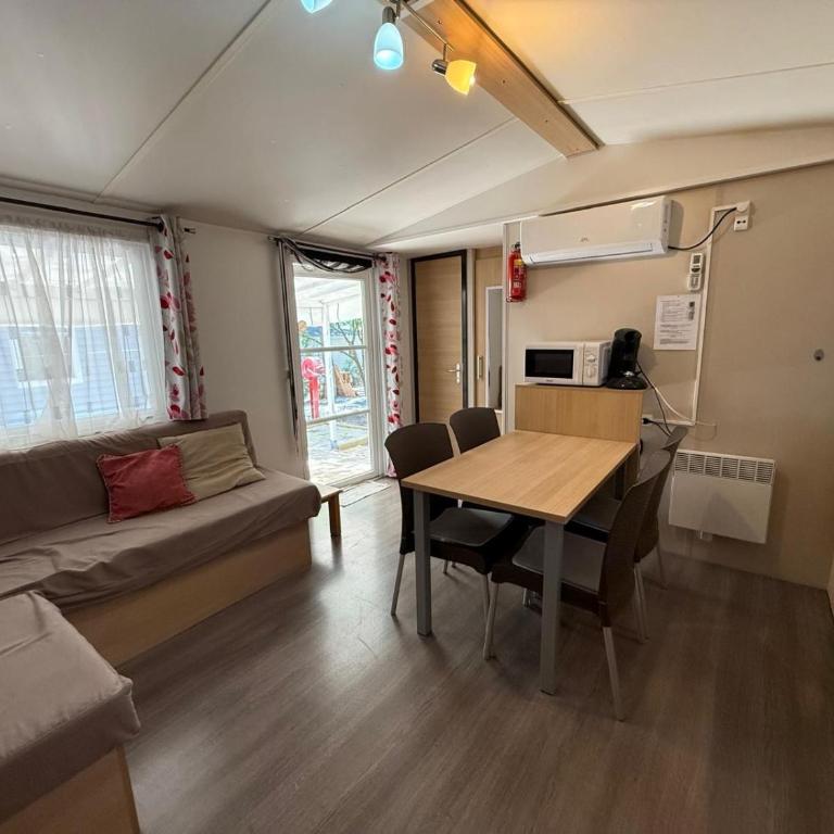 Chalets with kitchen outside at Camping Leï Suves - JoyCasa - Chalet 2 Chambres - 1