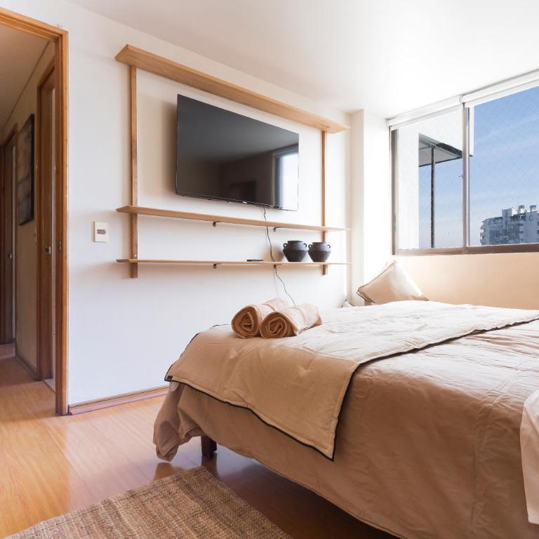 Amplio depto Familiar con aire acondicionado, frente al Parque Arauco - Apartment - 8