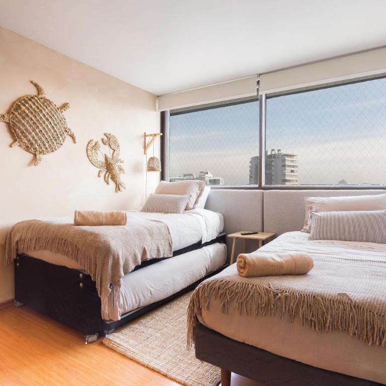 Amplio depto Familiar con aire acondicionado, frente al Parque Arauco - Apartment - 32