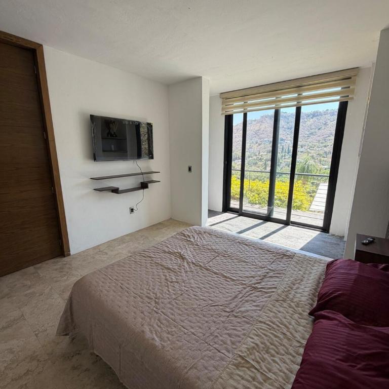 Casa estilo cabaña con alberca infinita climatizada - Four-Bedroom House - 18
