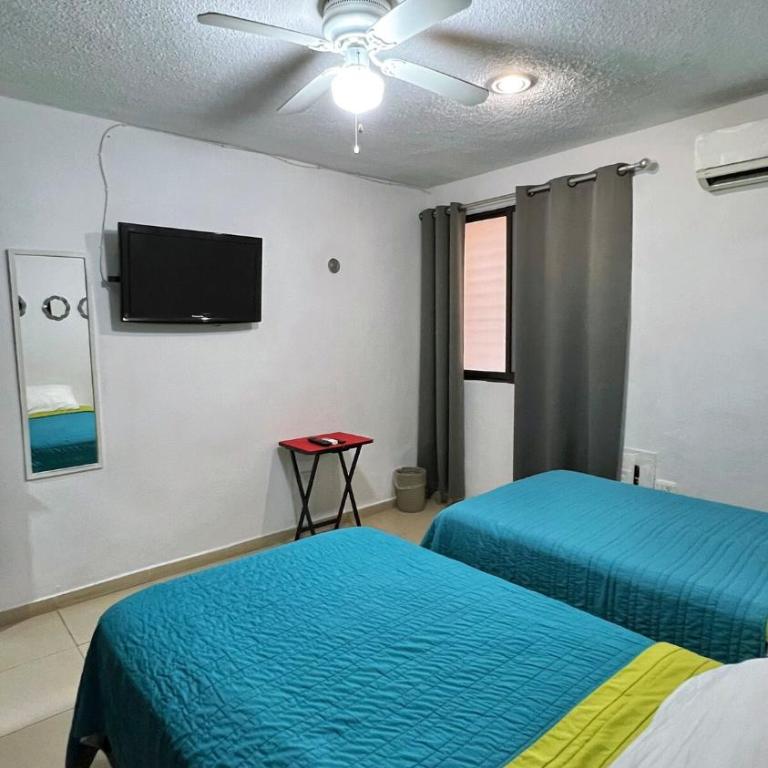 Home 365 Mérida Comodidad, amplitud total, 3 recamaras, 2 baños 5 camas ideal familias Consulado Americano - Three-Bedroom Apartment - 16