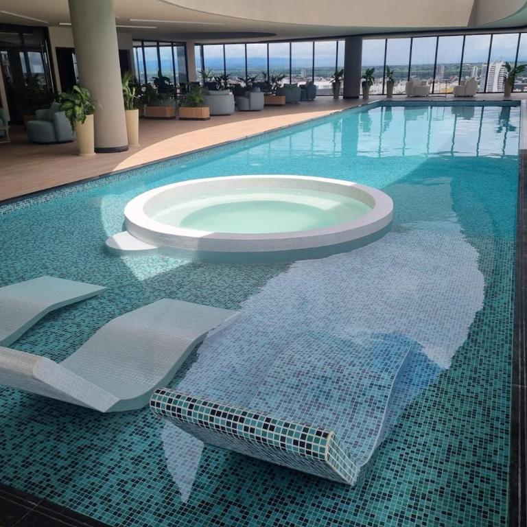 Balcon piso 16 - Escritorio - Piscina - Gym - One-Bedroom Apartment - 11