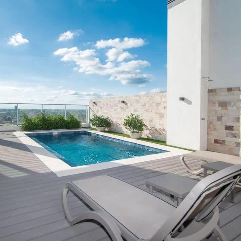 In the heart of Villamorra Rooftop Pool & BBQ - Apartment - 10
