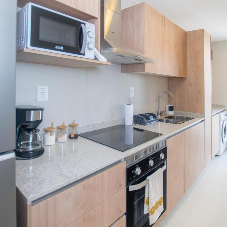 In the heart of Villamorra Rooftop Pool & BBQ - Apartment - 18