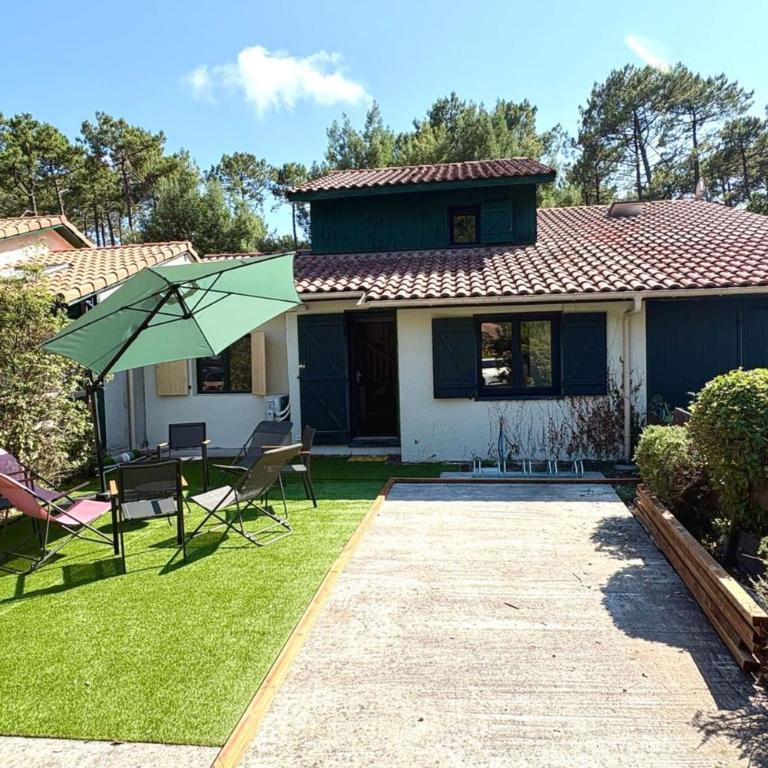 Maison avec jardin et piscine partagée à Moliets - Maison de Vacances - 23