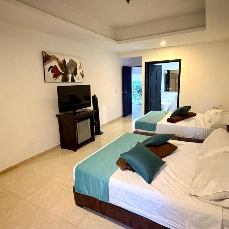 hotel turqueza inn - Habitación Cuádruple Confort - 8