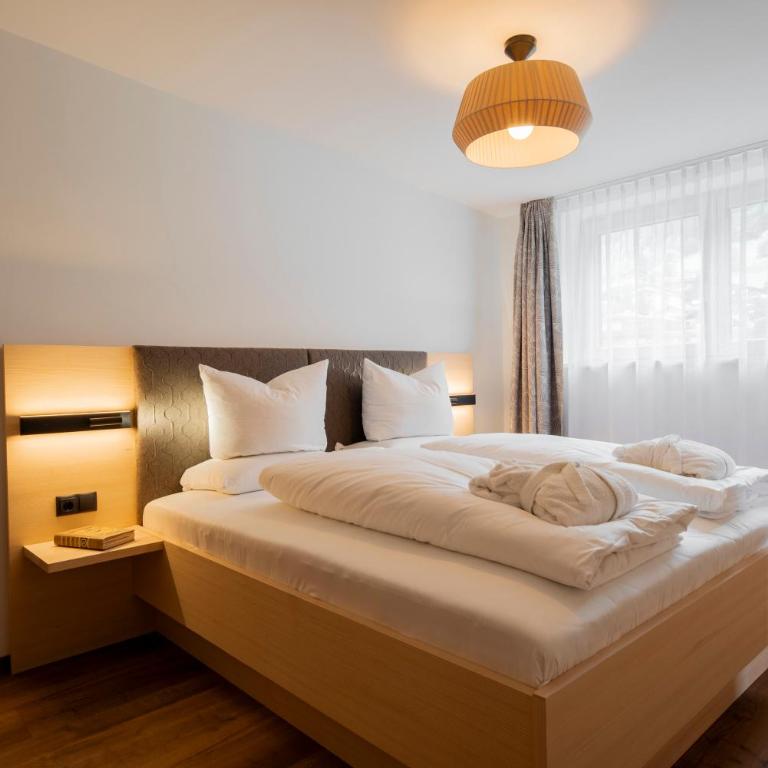 Aparthotel Saladina direkt an der Talstation - Deluxe Apartment mit 2 Schlafzimmern und Gartenblick - 1