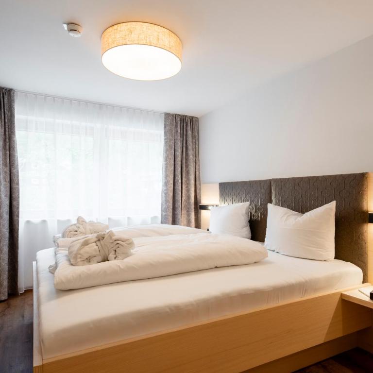 Aparthotel Saladina direkt an der Talstation - Apartment mit 1 Schlafzimmer, Balkon und Stadtblick - 2