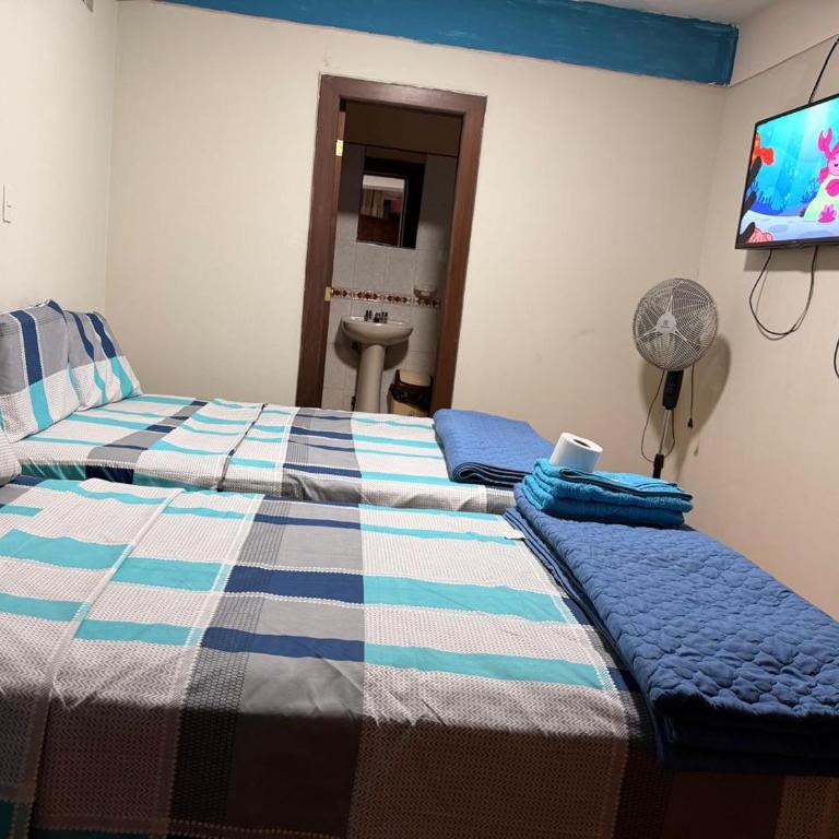 Hostal Muchik - Double Room with Two Double Beds - 1
