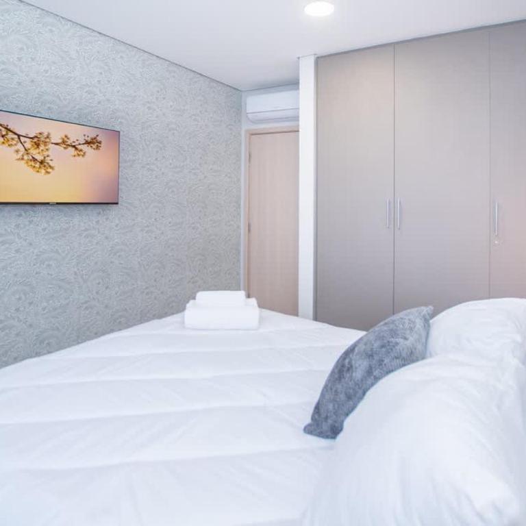 Cozy Central Stay Near Top Malls with Pool and Gym - Apartamento - 15