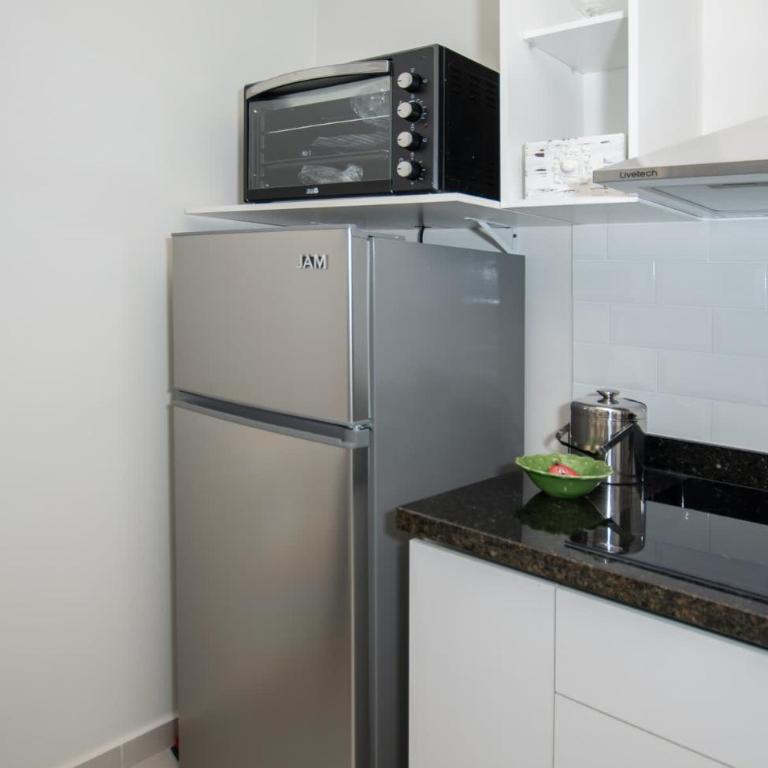 Vibrant Stay with Rooftop BBQ Pool and Near Malls - Apartamento - 24