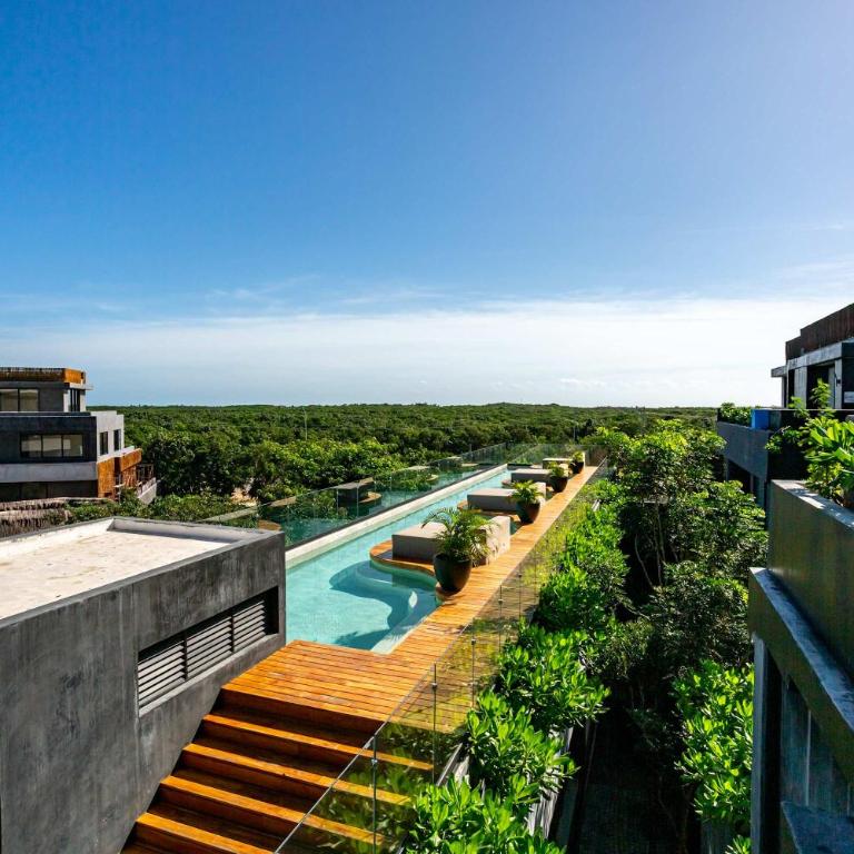 Modern 1BR Jungle View Retreat in Humana with Rooftop Pool - Apartment - 13
