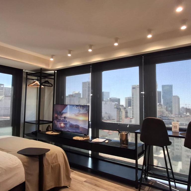 Comodidad y belleza, seguridad 24hs, céntrico, cochera, zona Galerías Pacífico y Obelisco - Apartamento Deluxe de 1 dormitorio con vistas a la ciudad - 1