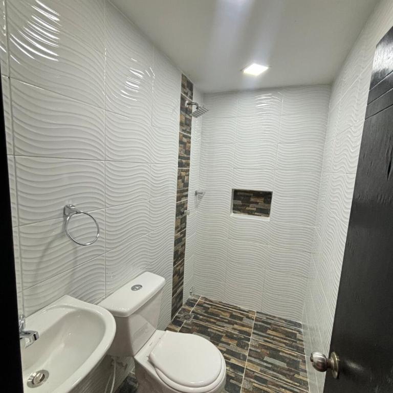 Tu sala exterior en el corazón de Bello - Two-Bedroom Apartment - 26