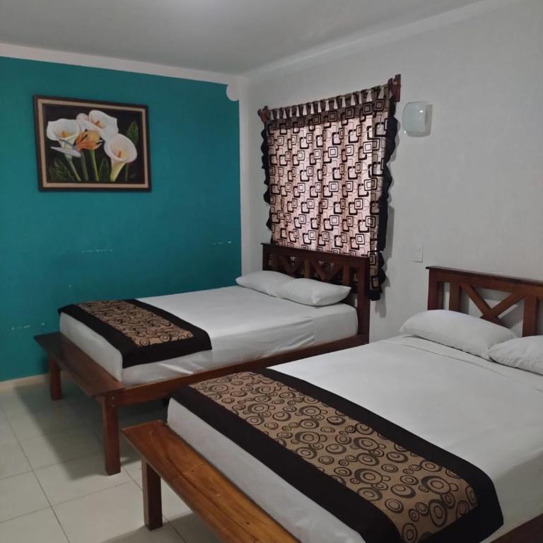 Hotel Las Palmas en Laurel - Habitación cuádruple - 10