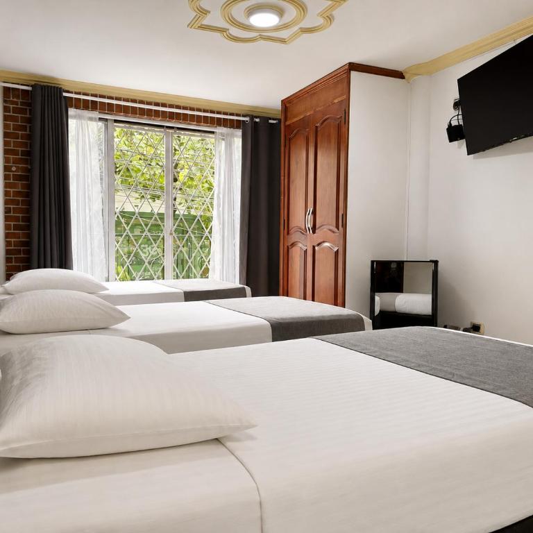 Hotel Boutique Laureles Home - Deluxe Triple Room - 1