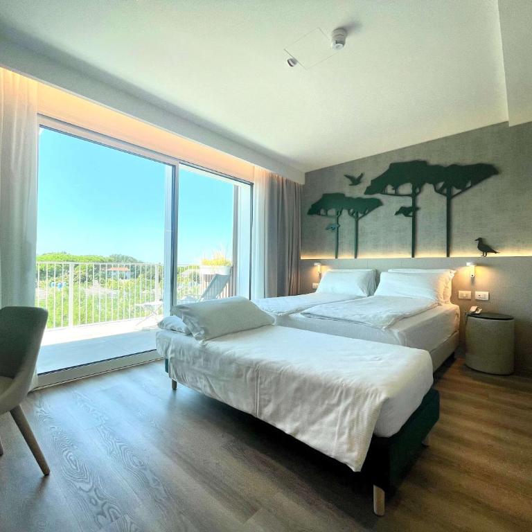 Junior Family Hotel - Camera Tripla Deluxe con Vista Mare - 1