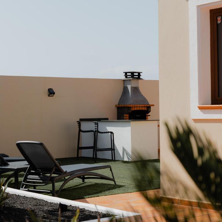 Moderne villa met verwarmd zwembad in Corralejo - Three-Bedroom Villa - 51