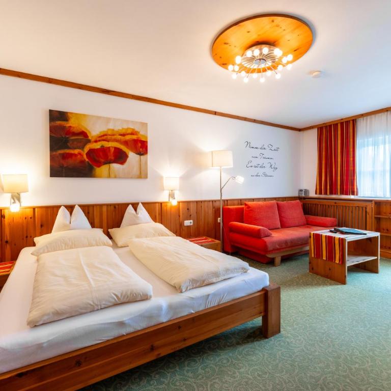 Die Nockalm - Dreibettzimmer mit Balkon - 1
