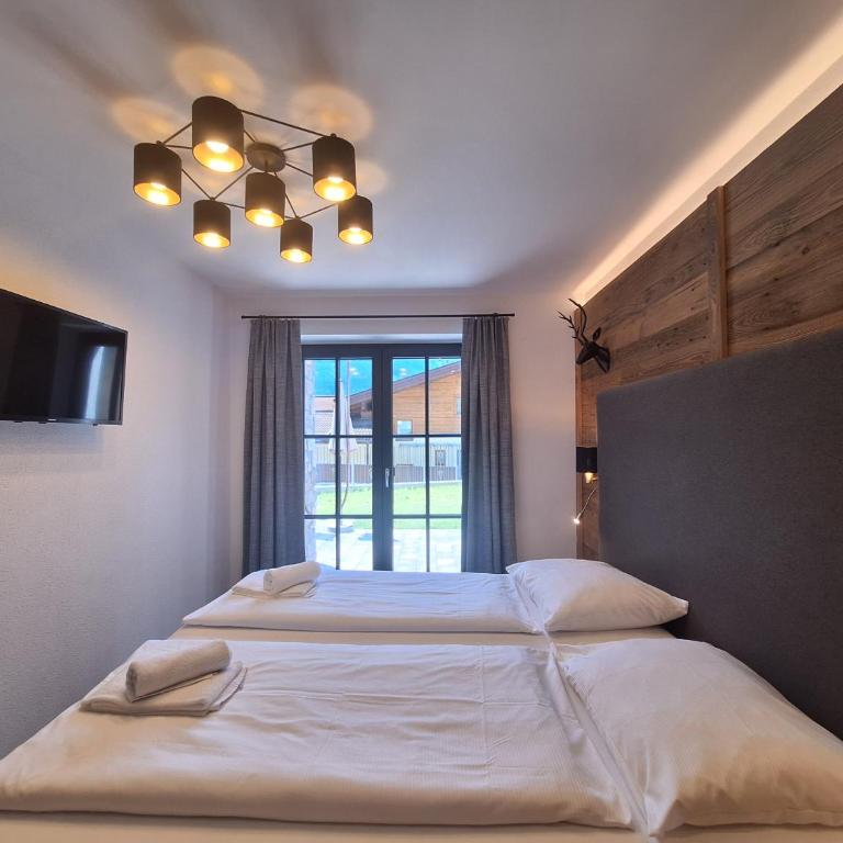 Mimis Bergnest Steinbock Lodges - Deluxe Apartment mit 2 Schlafzimmern und Gartenblick - 21