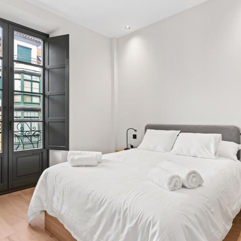 Espectacular apartamento en el centro, a 3 min de la playa de San Lorenzo - Apartamento de 2 dormitorios - 12