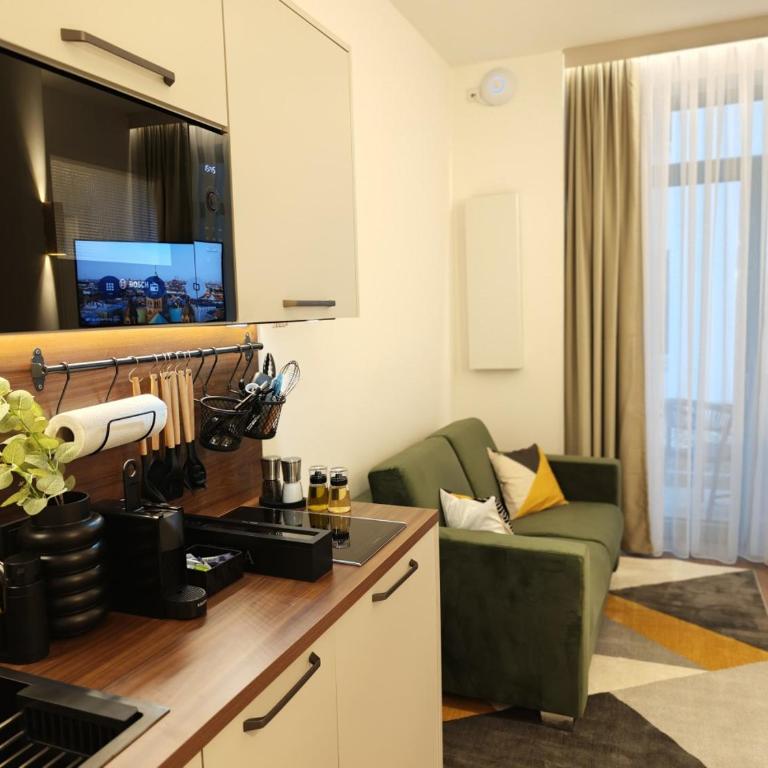 Homely Stay City Apartments - Apartment mit 1 Schlafzimmer und Terrasse - 1