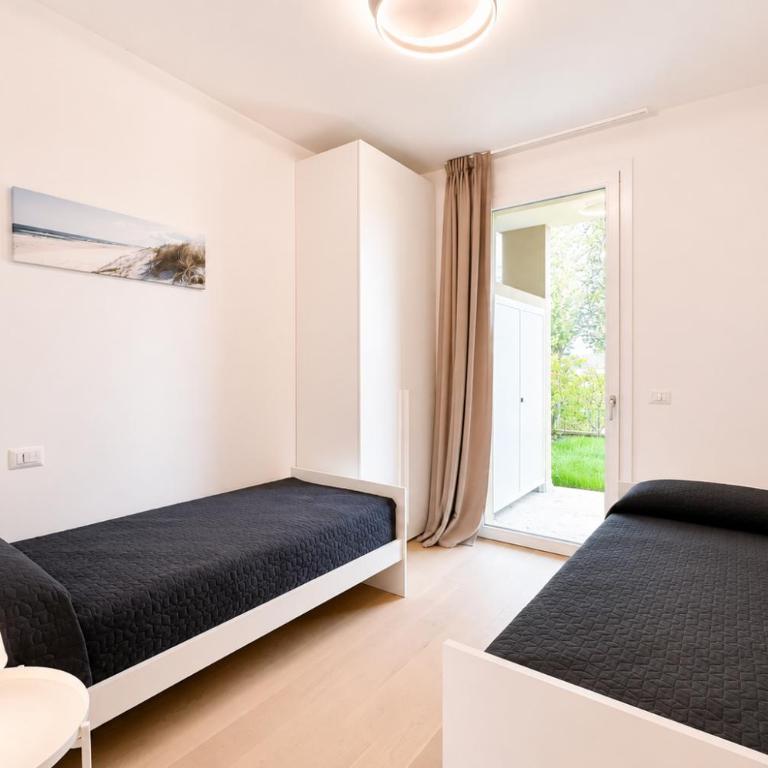 Residence Wave Island - Carraro Immobiliare - Family Apartments - Two-Bedroom Apartment with Pool View - 23