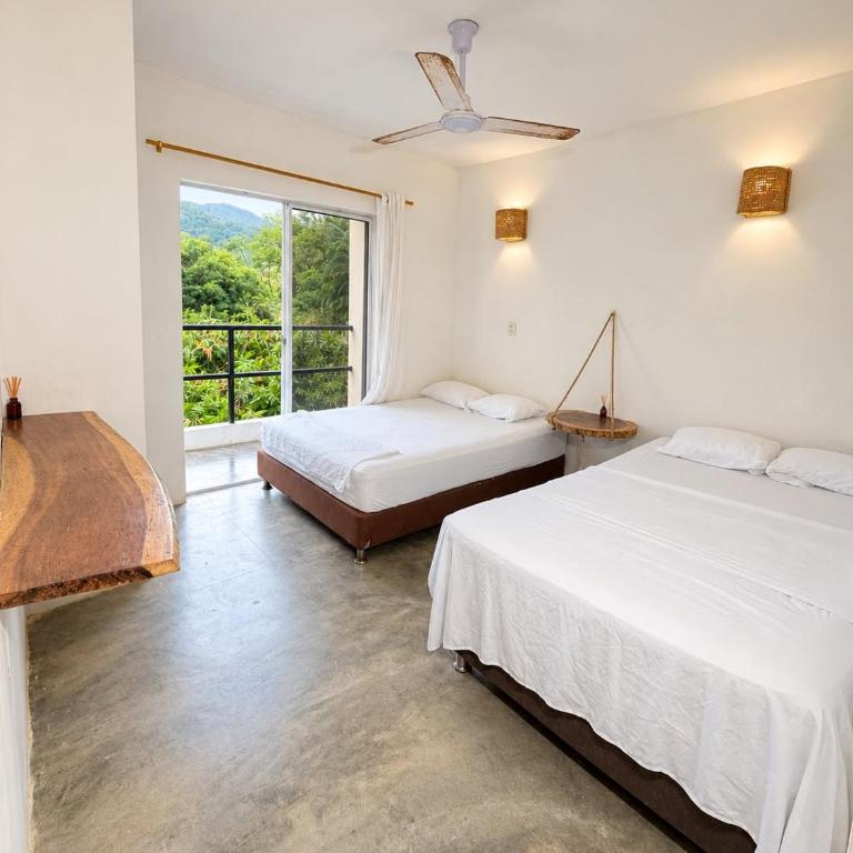 hotel Tayrona Angel Lodge cerca a la entrada el zaino parque nacional tayrona - Habitación Doble - 2 camas dobles - 4