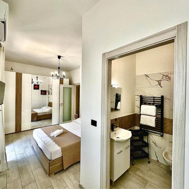 Bilocale,4 posti letto,2 bagni, parcheggio privato - Appartamento con 1 Camera da Letto - 18