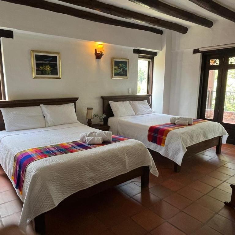 La Posada De Los Arcángeles - Quadruple Room with Balcony - 1