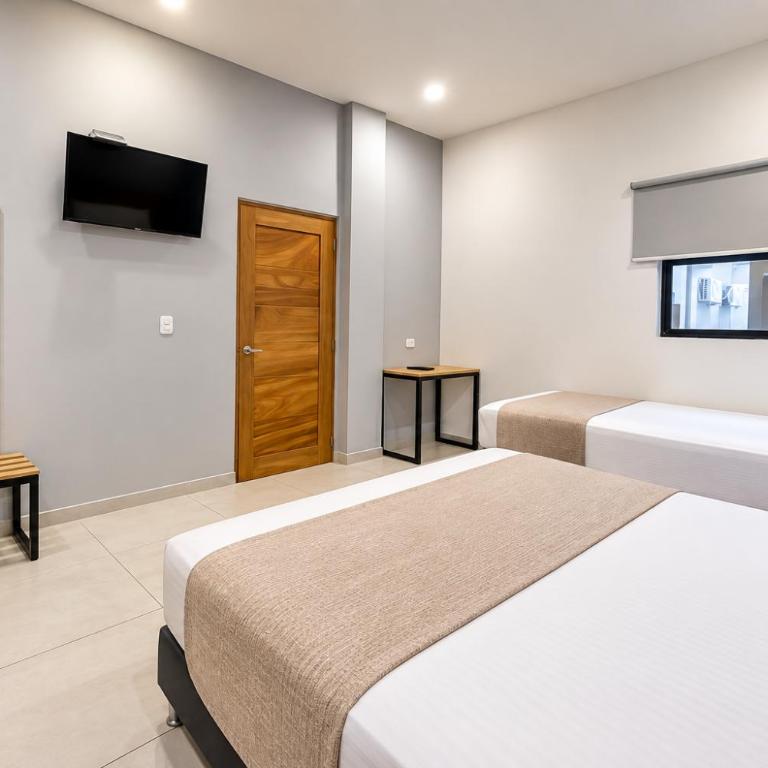 Stanza Hotel Sincelejo - Habitación Doble - 2 camas dobles - 2