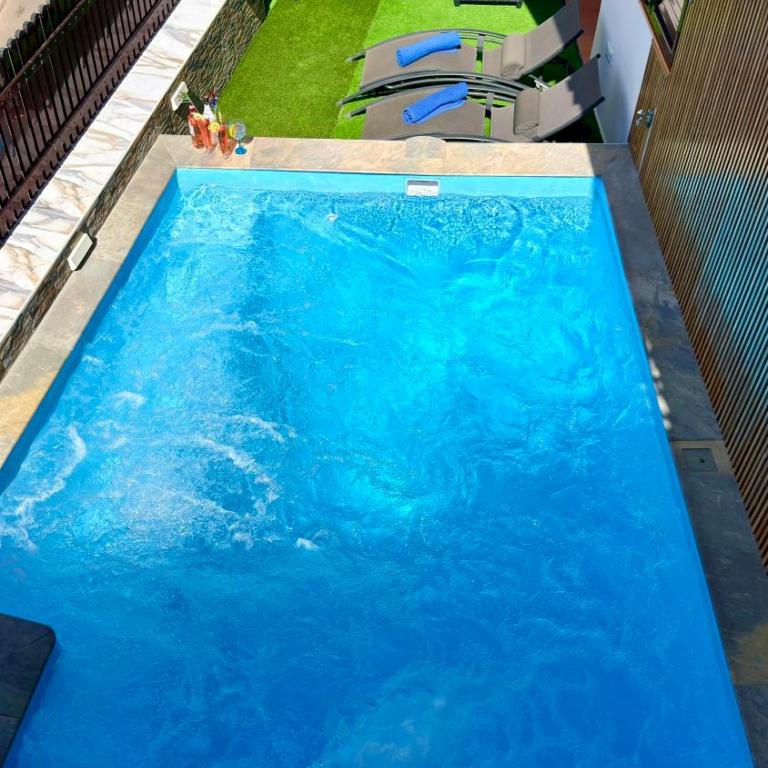 Villas Puerto Rico in front of the shopping center with private heated saltwater pool with jacuzzi function & arcade games - Villa Estándar - 13