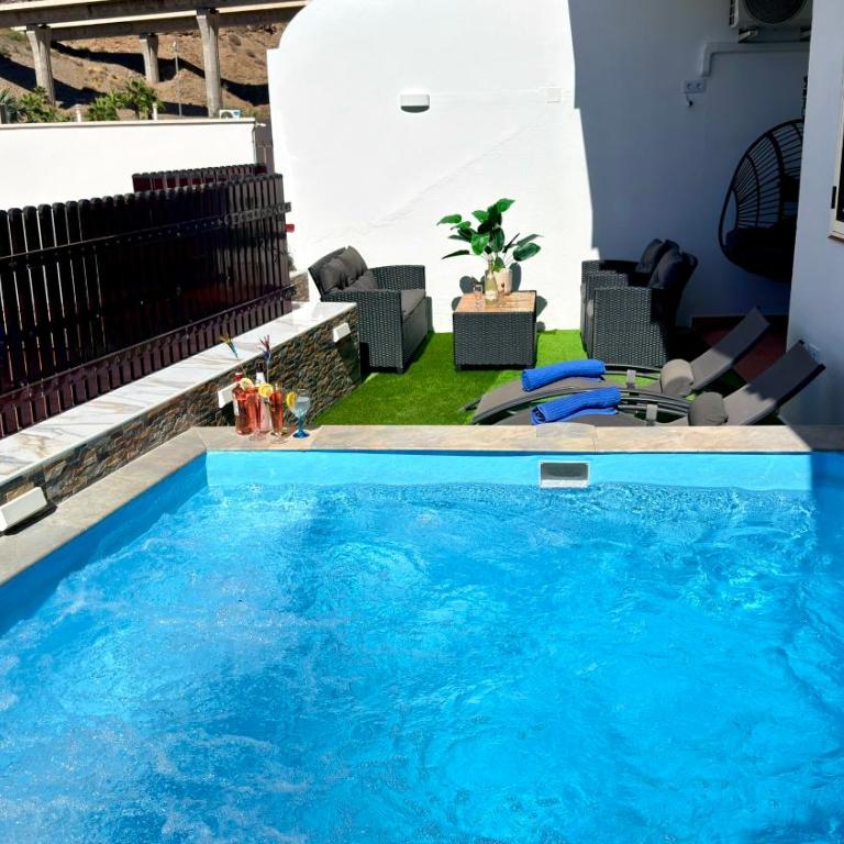 Villas Puerto Rico in front of the shopping center with private heated saltwater pool with jacuzzi function & arcade games - Villa Estándar - 12