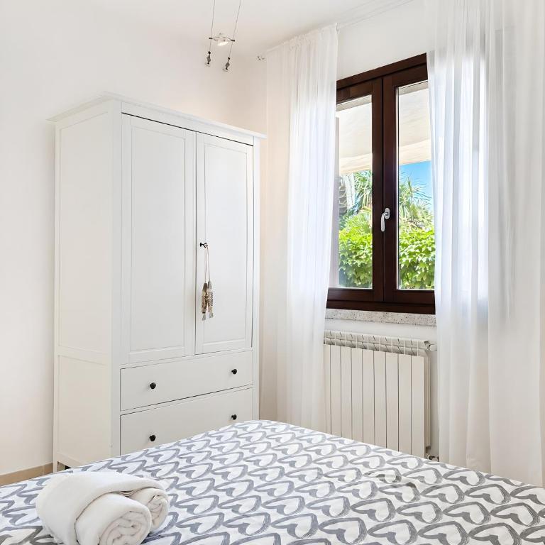 C 102 Puntavilla Mare - Appartamento Deluxe con 2 Camere da Letto e Vista Giardino - 14