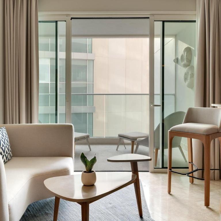 Amare Cancun Adults Only All-Inclusive Resort, Curio Hilton - Junior King Suite with One King Bed and Lagoon View - 1