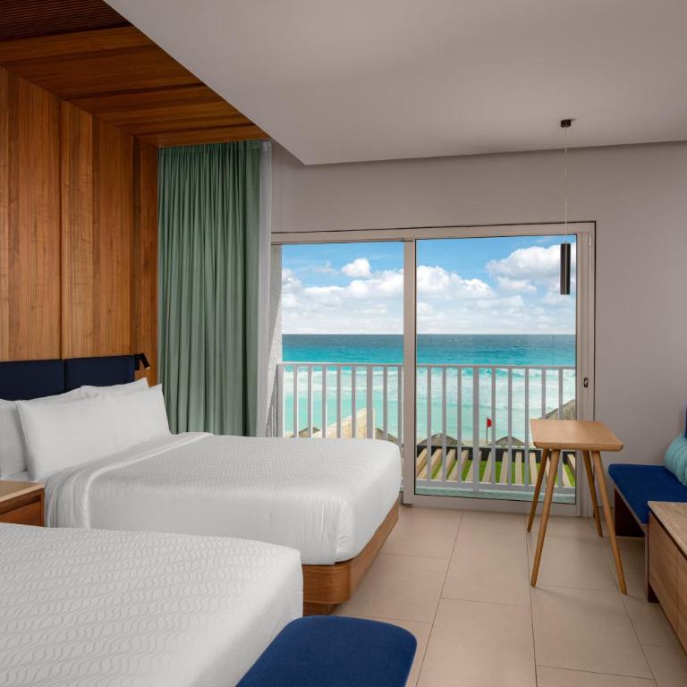 Hilton Cancun Mar Caribe All-Inclusive Resort - Habitación Enclave frente a la playa con balcón - 2 camas grandes - 2