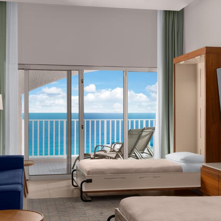 Hilton Cancun Mar Caribe All-Inclusive Resort - Suite Enclave con vistas al mar - 1 cama extragrande y 2 camas plegables - 5
