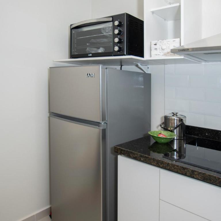 Vibrant Stay with Rooftop BBQ Pool and Near Malls - Apartamento - 24
