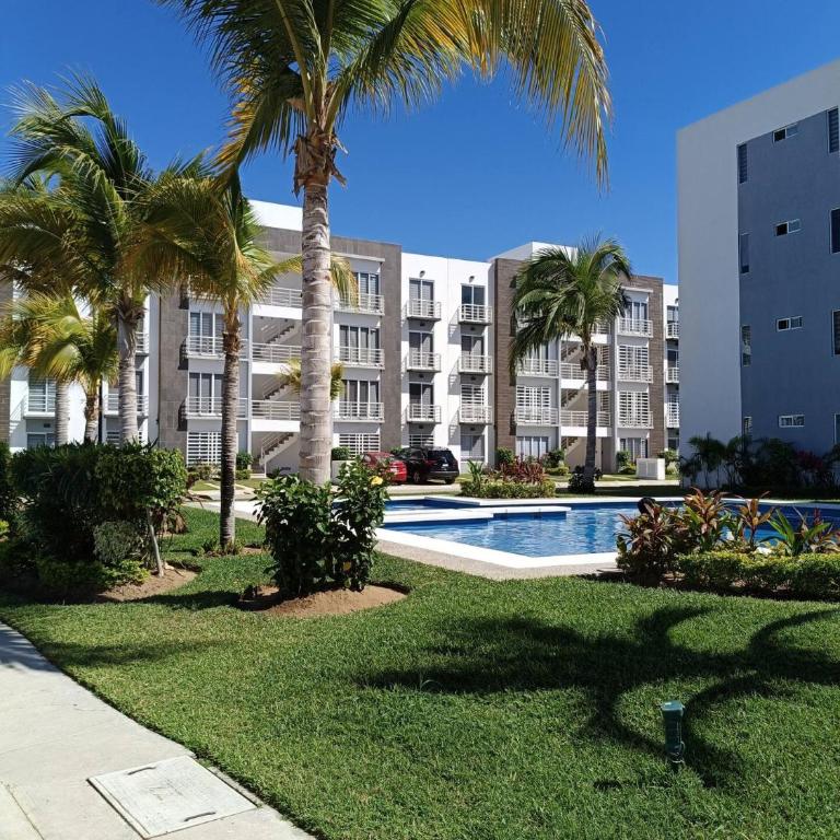Departamento en Acapulco Con Alberca y Club de Playa Planta Baja - Three-Bedroom Apartment - 21