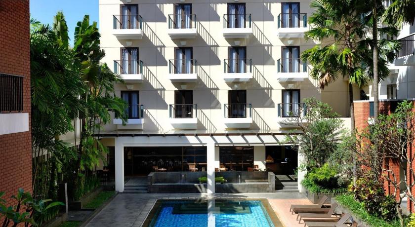 a large building with a pool and a balcony, Hotel Santika Premiere Malang in Malang