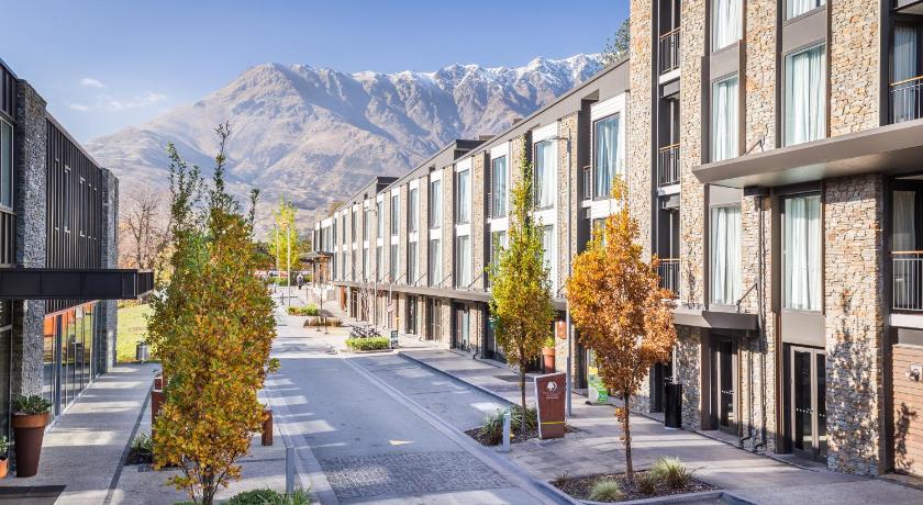 a city street with trees and buildings, DoubleTree by Hilton Queenstown in Queenstown
