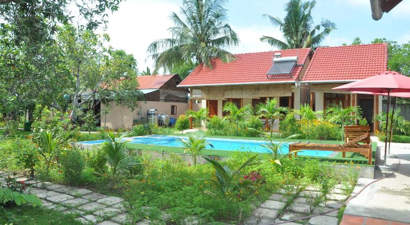 a green and white house with a pool and trees, Thuy Van Bungalow Phu Quoc in Phu Quoc Island