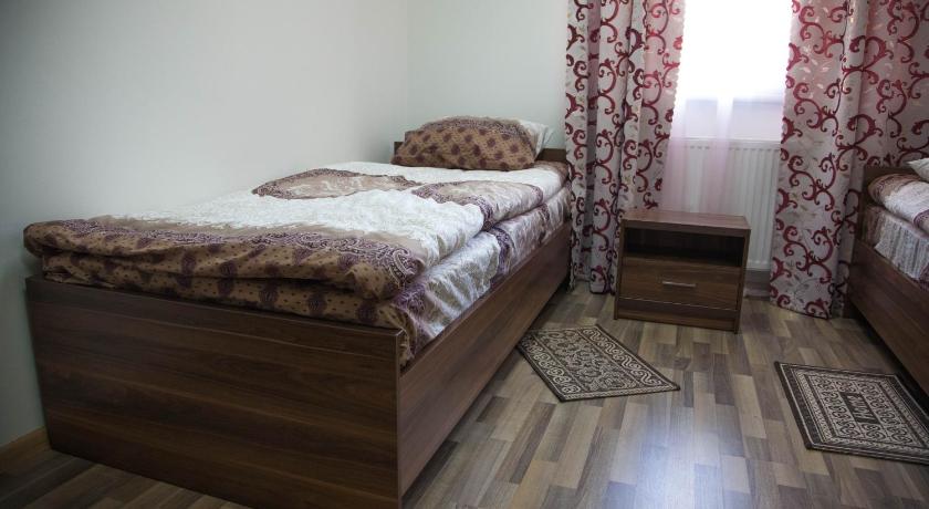 Foto, millel on kujutatud Kaheinimesetuba, Twin - Aiavaatega (Twin Room with Garden View) 0