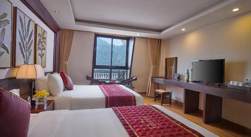 Image of Deluxe Triple - 1 Double Bed and 1 Single Bed 1